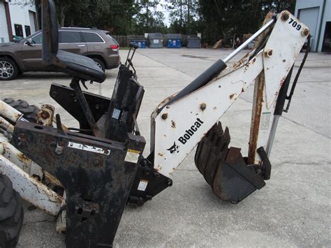 model 709 backhoe attachment for a bobcat skid steer|bobcat 709 backhoe attachment price.